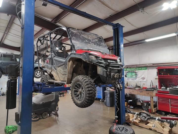 Honda Pioneer UTV on lift at Nemtec Automotive Hiwasse AR